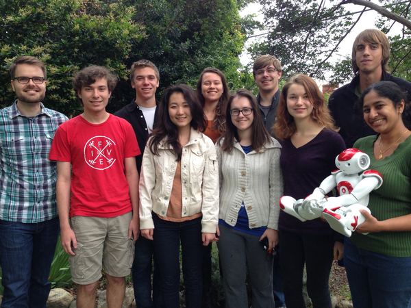 HEATlab group photo outdoors, with a student holding a NAO robot