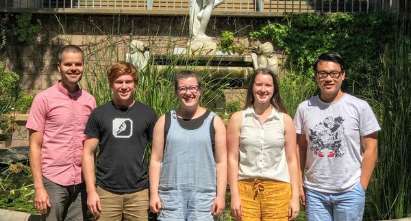 HEATlab group photo in a sunny courtyard garden